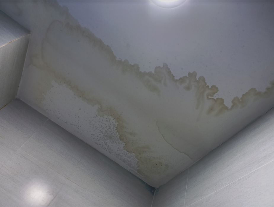 a water damaged ceiling with watermarks on it