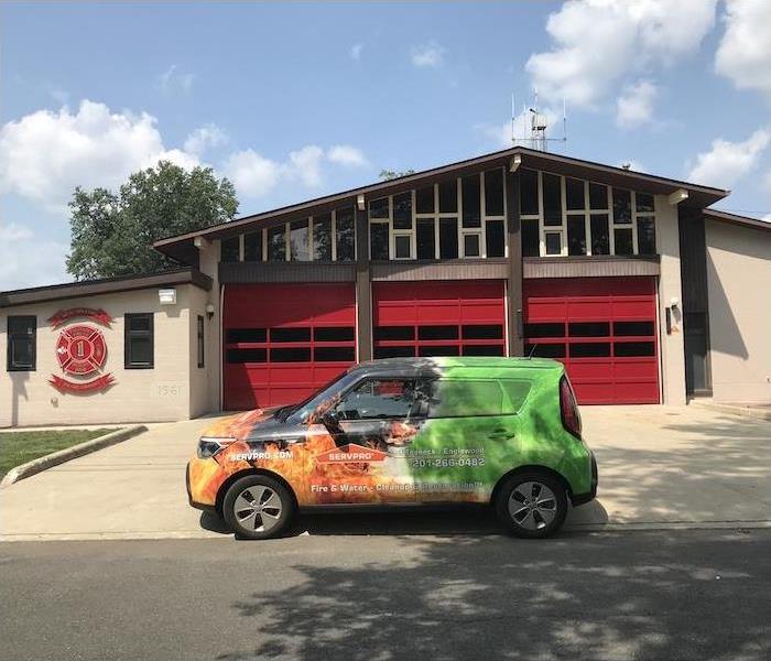 SERVPRO car in front of a fire station